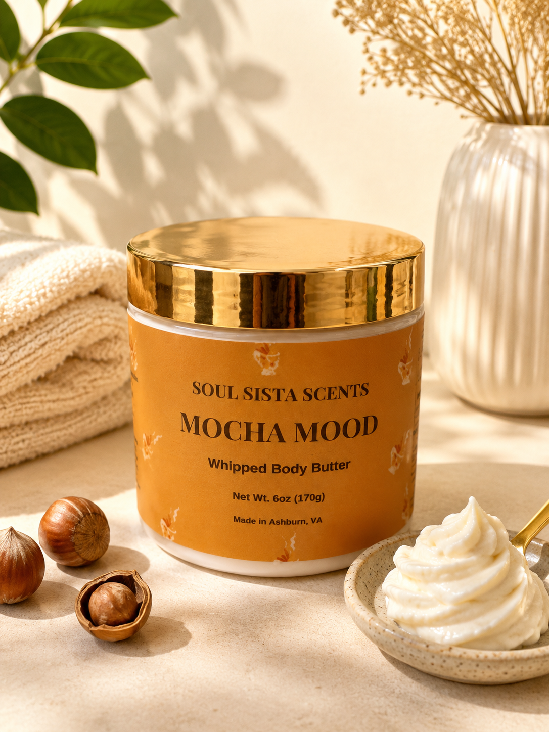 Soul Sista Scents Mocha Mood Whipped Body Butter gold lid jar with a dish of swirled whipped cream and hazelnuts

