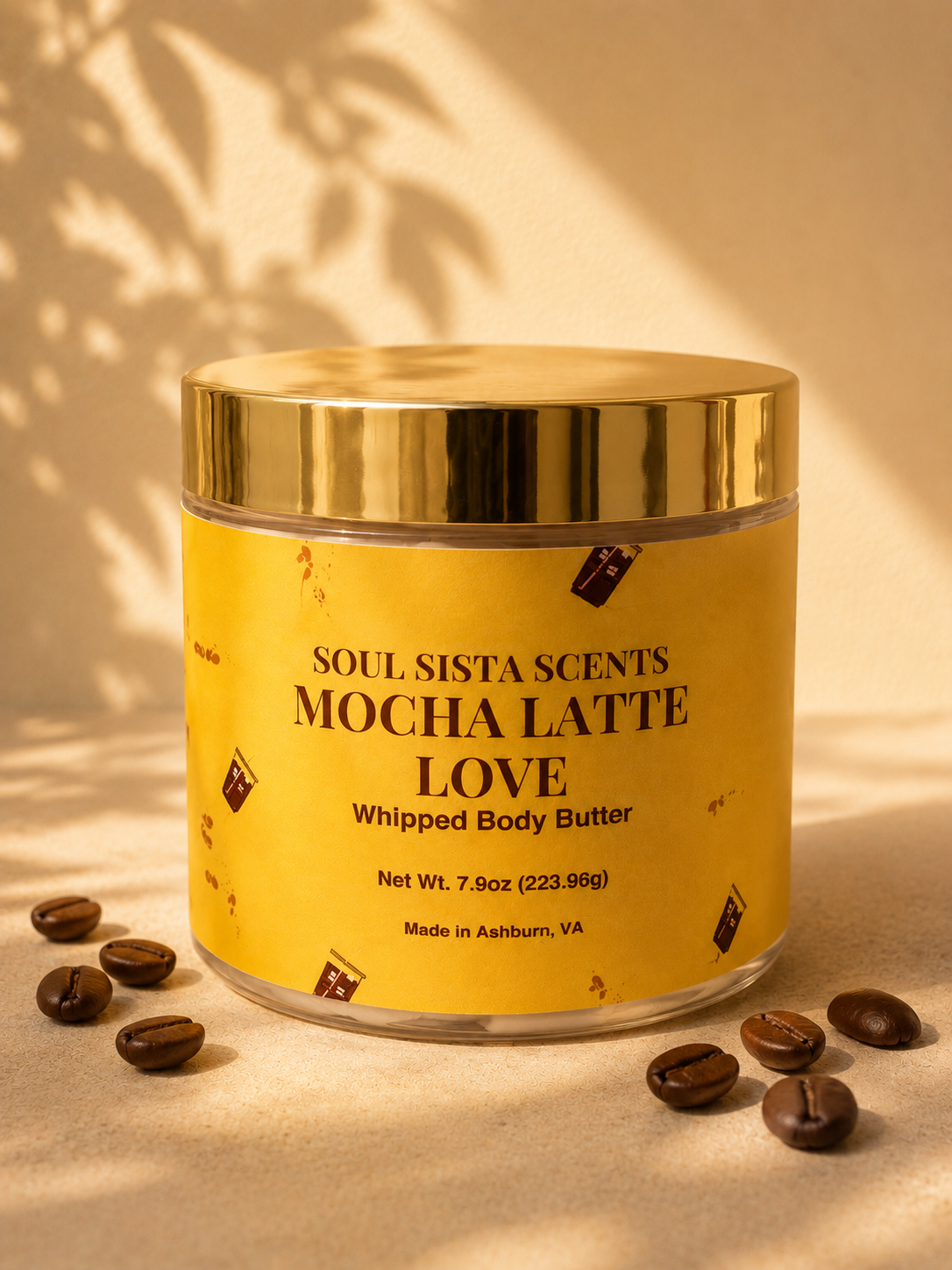 Soul Sista Scents Mocha Latte Love Whipped Body Butter jar with gold lid styled with coffee beans in warm sunlight


