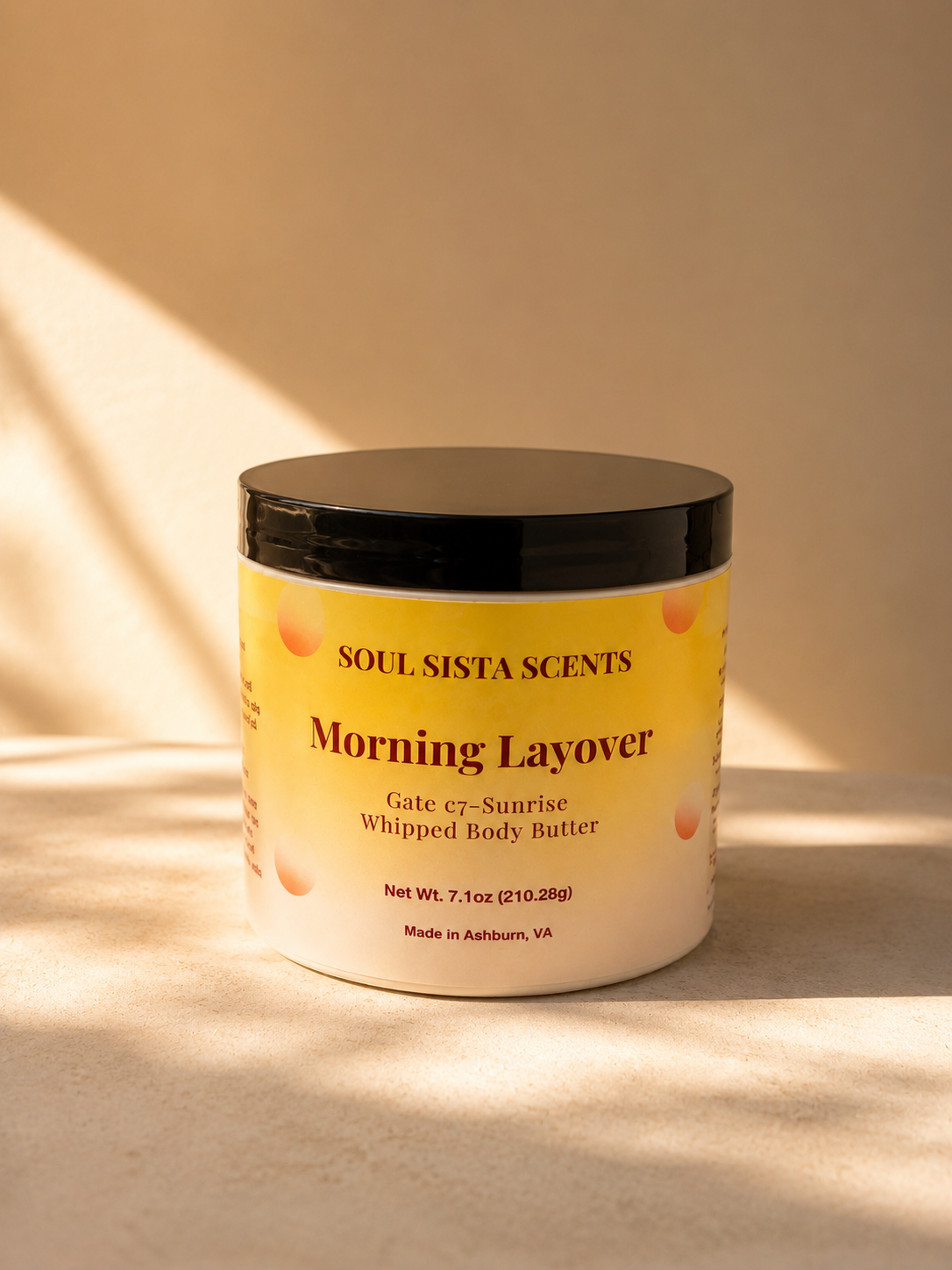 Soul Sista Scents Morning Layover Gate c7 Sunrise Whipped Body Butter jar in warm natural sunlight and leaf shadows

