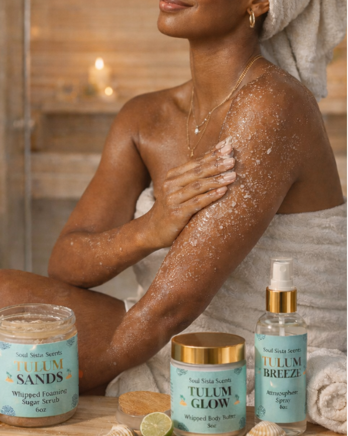 Woman in spa bathroom with Tulum Sands ritual products